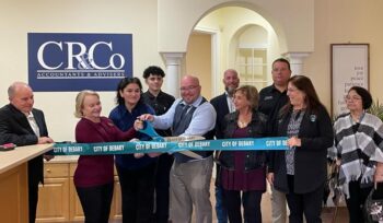 City of DeBary's Mayor, Vice-Mayor and Churchill, Rossi & Co Staff cutting a blue ribbon as a formal grand opening for CR&Co