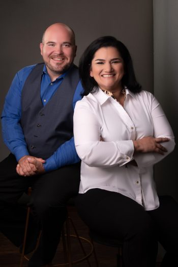 Jeff Foust and Karolina Churchill, Rossi & Co. Management Standing Side by Side